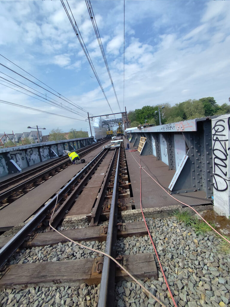 Sandblasting & Protective Painting of Railway Bridge Steel Structure